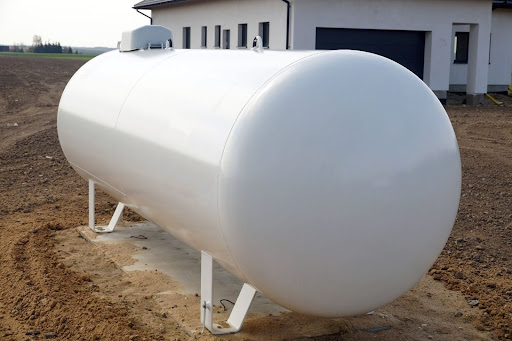 Residential heating propane tank installed outside a home in rural Wisconsin